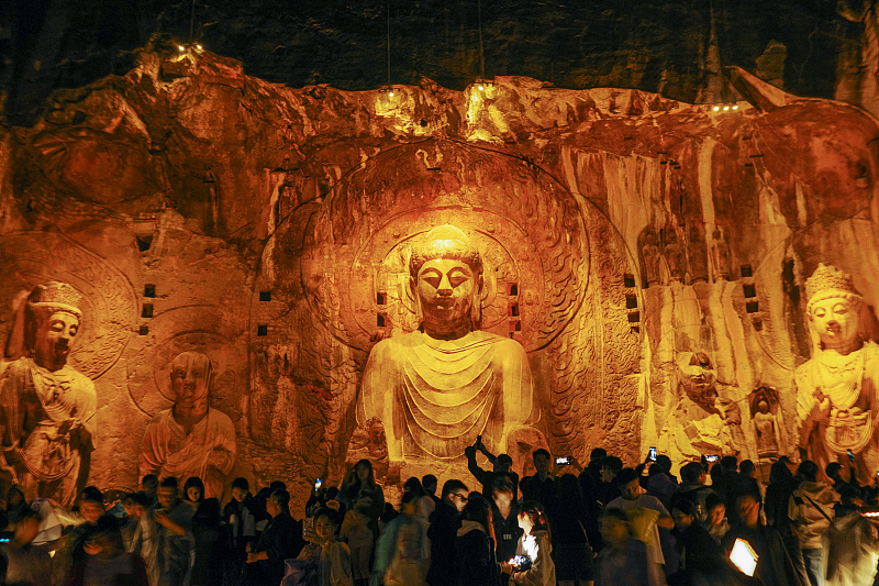 The Longmen Grottoes are seen illuminated at night in Luoyang City, Henan Province, October 4, 2023. /CFP