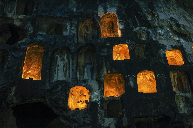 The Longmen Grottoes are seen illuminated at night in Luoyang City, Henan Province, October 4, 2023. /CFP
