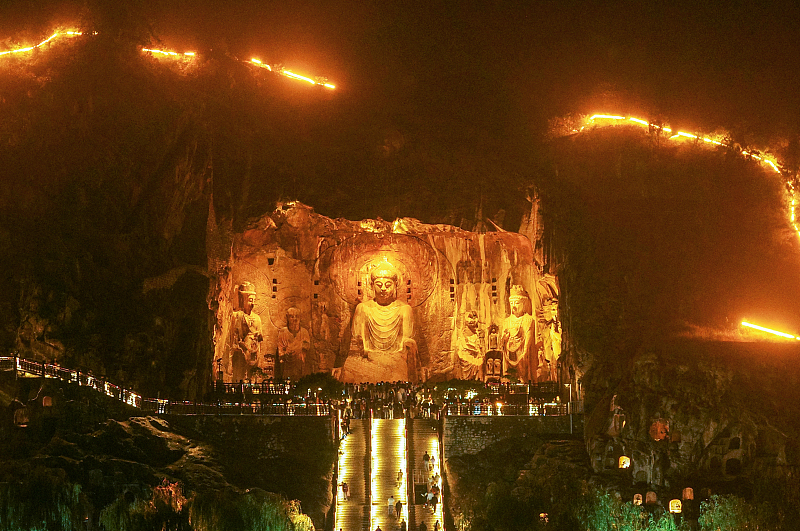 The night views of Longmen Grottoes attract many visitors to Luoyang City, Henan Province, October 4, 2023. /CFP