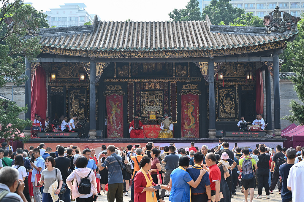 A photo taken on November 4, 2023, shows visitors watching Cantonese opera at the Ancestral Temple in Foshan, Guangdong Province, China. /CFP