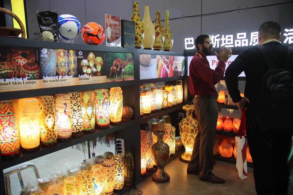 A photo taken on November 5, 2023, shows camel skin lamps exhibited at the China International Import Expo in Shanghai. /IC