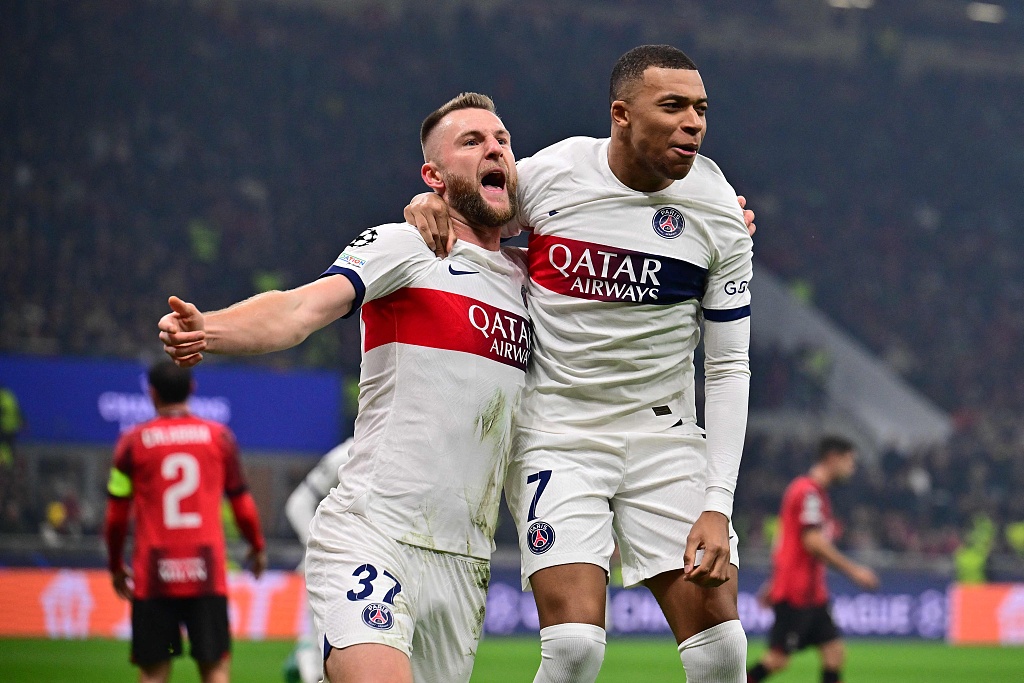 PSG's Milan Skriniar (L) celebrates with Kylian Mbappe after scoring the opening goal during their Champions League match at the San Siro stadium in Milan, Italy, November 7, 2023. /CFP