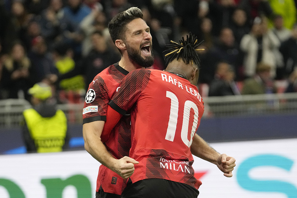 AC Milan's Olivier Giroud (L) celebrates with his teammate Rafael Leao  during their Champions League match at the San Siro stadium in Milan, Italy, November 7, 2023. /CFP