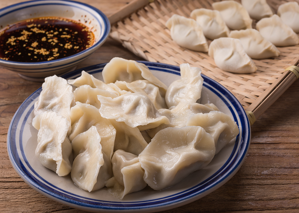 A photo shows a plate of dumplings. /CFP