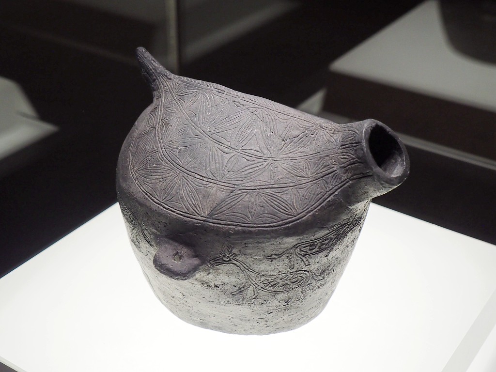 A photo taken on November 8, 2023, shows a pottery relic on display at a Hemudu Culture exhibition at the National Museum of China in Beijing. /CFP