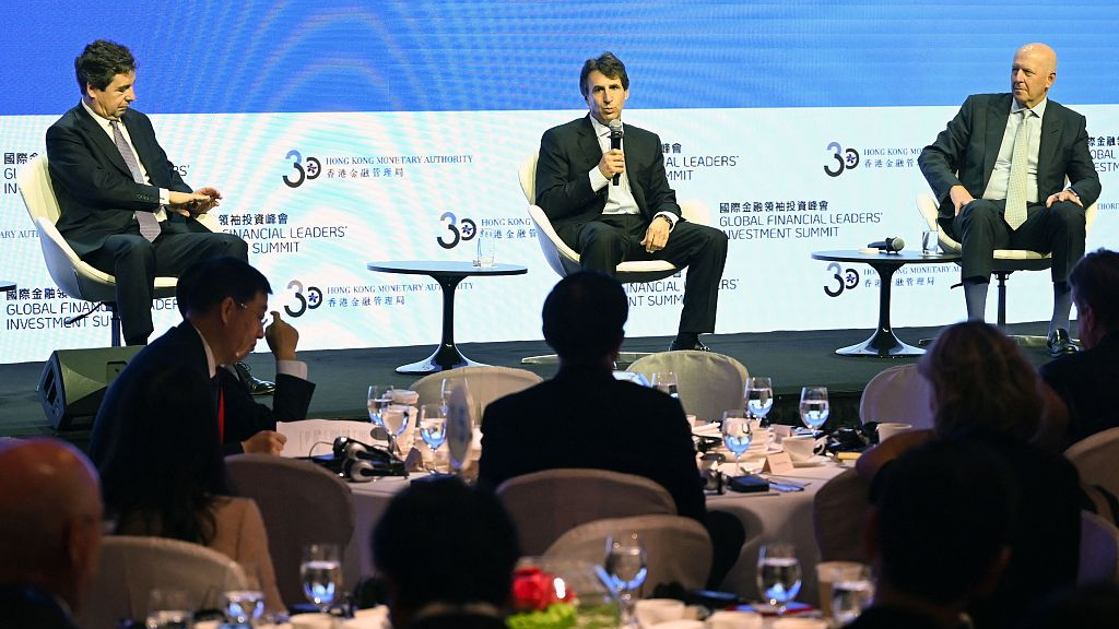 Marc Rowan, chief executive officer of Apollo Global Management (C) speaks at the 2023 Global Financial Leaders' Investment Summit as Peter Harrison, chief executive officer of Schroders Plc (L), David Solomon, chief executive officer of Goldman Sachs, and audience listen in south China's Hong Kong Special Administrative Region, November 7, 2023. /CFP