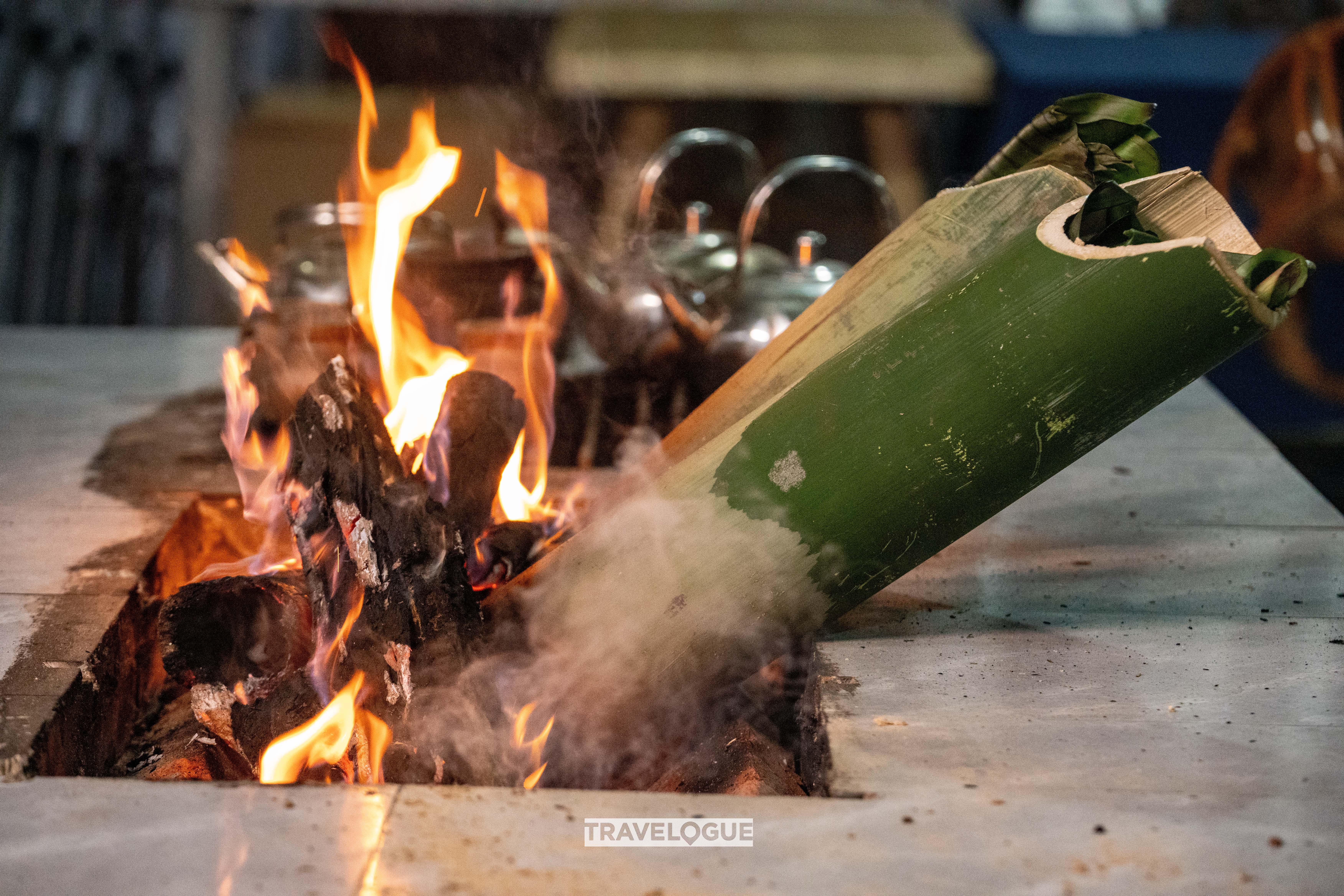 Bamboo is stuffed with chicken and rice and cooked on an open fire. /CGTN