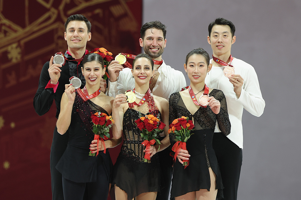 L-R: Italian, Canadian, and Chinese figure skaters at the doubles event award ceremony of Cup of China in Chongqing, China, November 11, 2023. /CFP