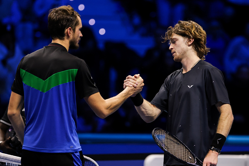 Daniil Medvedev (L) and Andrey Rublev shake hands after their group stage encounter at the ATP Finals in Turin, Italy, November 13, 2023. /CFP