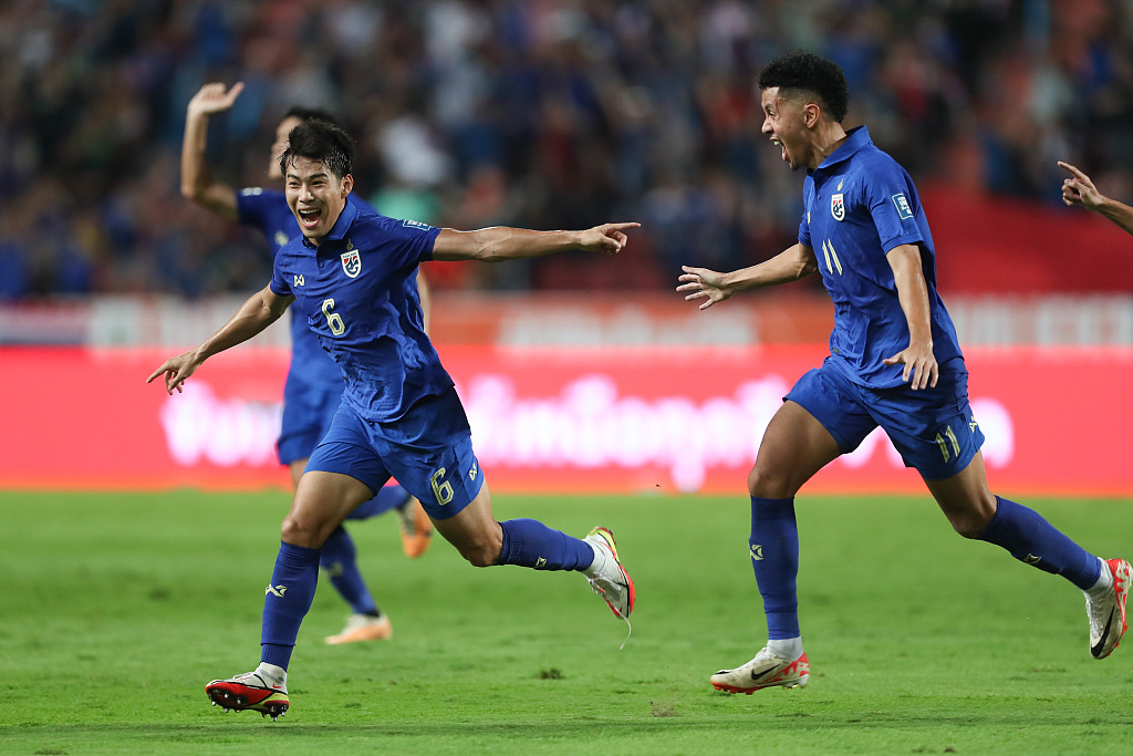 Thailand's Sarach Yooyen (L) reacts after breaking the deadlock during their clash with China at the Rajamangala Stadium in Bangkok, Thailand, November 16, 2023. /CFP