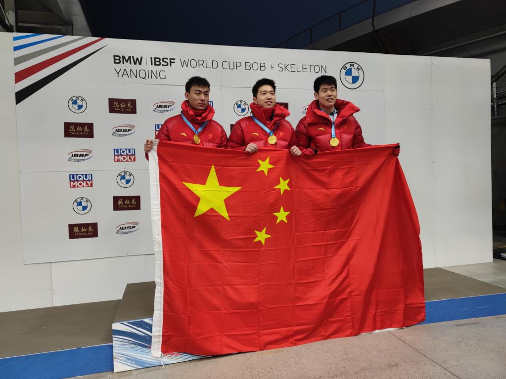 L-R: Yin Zheng, Chen Wenhao and Yan Wengang of China pose for a photo competing in the men's skeleton event at the International Bobsleigh & Skeleton Federation World Cup at the Yanqing National Sliding Center in Beijing's Yanqing District, November 17, 2023. /Xinhua