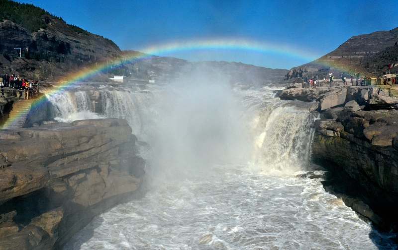 A rainbow appears above the Hukou Waterfall on the Yellow River in Linfen City, Shanxi Province, November 17, 2023. /CFP