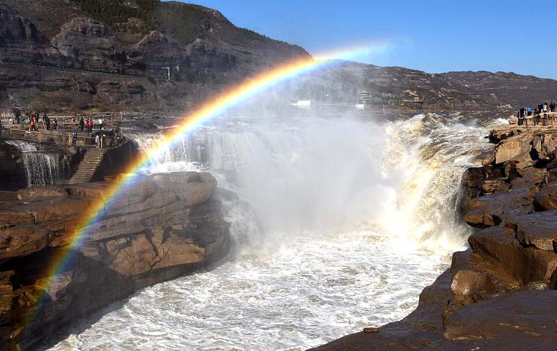 A rainbow appears above the Hukou Waterfall on the Yellow River in Linfen City, Shanxi Province, November 17, 2023. /CFP