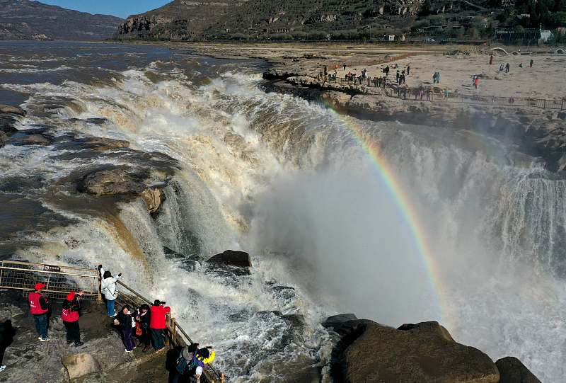 Visitors to the Hukou Waterfall on the Yellow River catch a rare glimpse of a double rainbow in Linfen City, Shanxi Province on November 17, 2023. /CFP