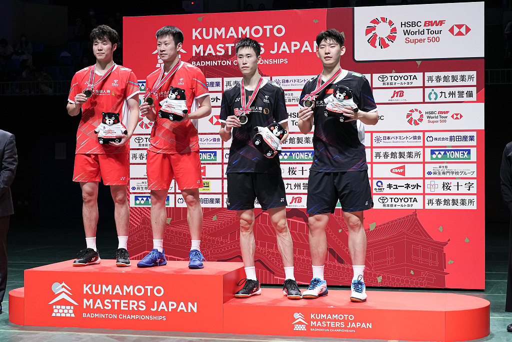 L-R: China's He Jiting, Ren Xiangyu, Ou Xuanyi and Liu Yuchen celebrate on the podium after their men's doubles final during the BWF Japan Masters in Kumamoto, Japan, November 19, 2023. /CFP