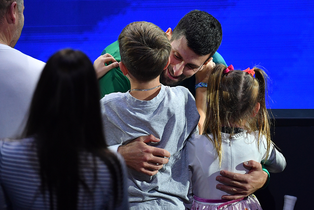 Novak Djokovic celebrates with his children after winning the singles final tennis match of the ATP Finals in Turin, Italy, November 19, 2023. /CFP
