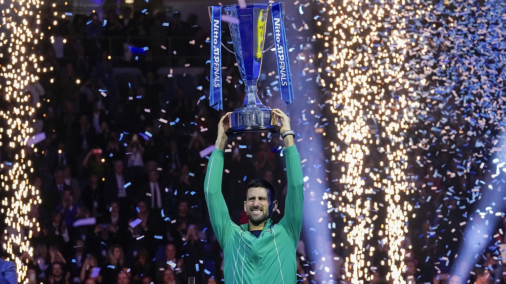 Novak Djokovic celebrates with the trophy after winning the singles final tennis match of the ATP Finals in Turin, Italy, November 19, 2023. /CFP