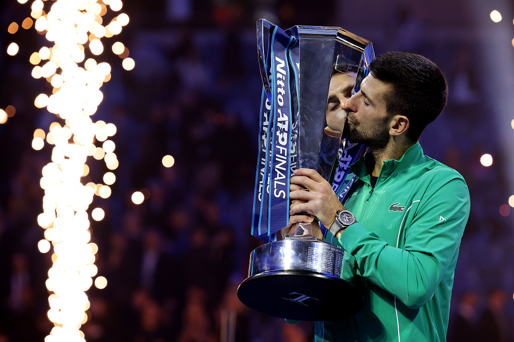 Novak Djokovic kisses the ATP Finals trophy in Turin, Italy, November 19, 2023. /CFP