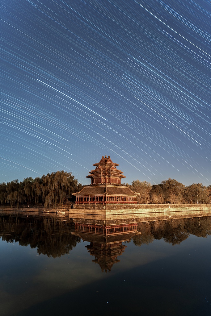 Star trails are seen over a corner tower of the Palace Museum in Beijing on November 17, 2023. /CFP