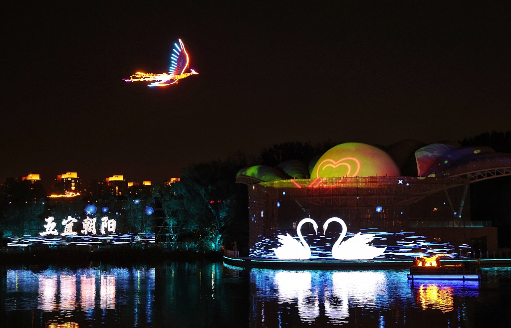 A light show featuring a phoenix takes place at the Liangma River in Chaoyang District, Beijing on November 19, 2023. /CFP