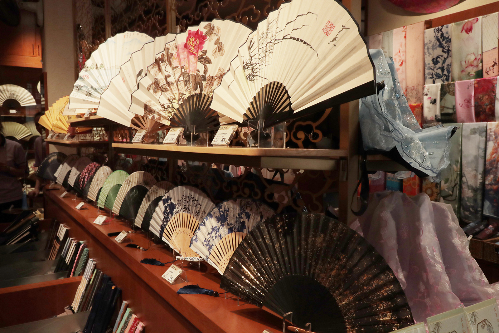 Handheld folding fans are on display at a shop on Qinghefang Street in Hangzhou, Zhejiang Province. /CGTN
