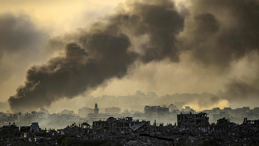 Smoke rising above buildings during Israeli strikes on the northern part of the Palestinian enclave, November 22, 2023. /CFP