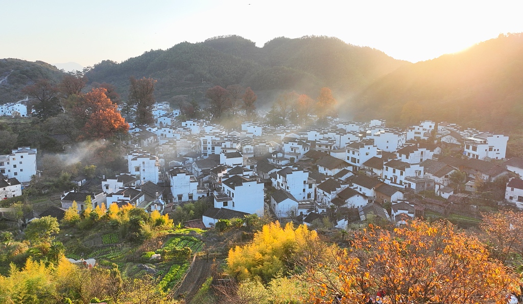 Shicheng Village in Wuyuan County, east China's Jiangxi Province is illuminated by morning sunshine on November 23, 2023. /CFP