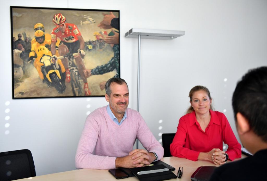 The Union Cycliste Internationale World Cycling Center Director Jacques Landry (L) takes an interview with Xinhua News Agency in Aigle, Switzerland, November 23, 2023. /Xinhua