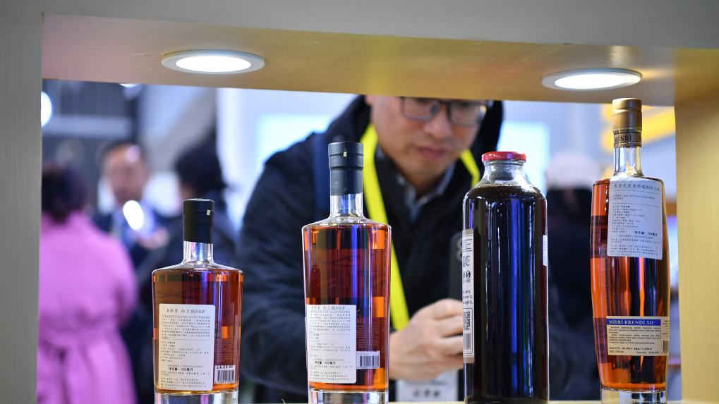 A visitor views products at the booth of Azerbaijan during the Seventh Silk Road International Exposition in Xi'an, capital of northwest China's Shaanxi Province, November 16, 2023.