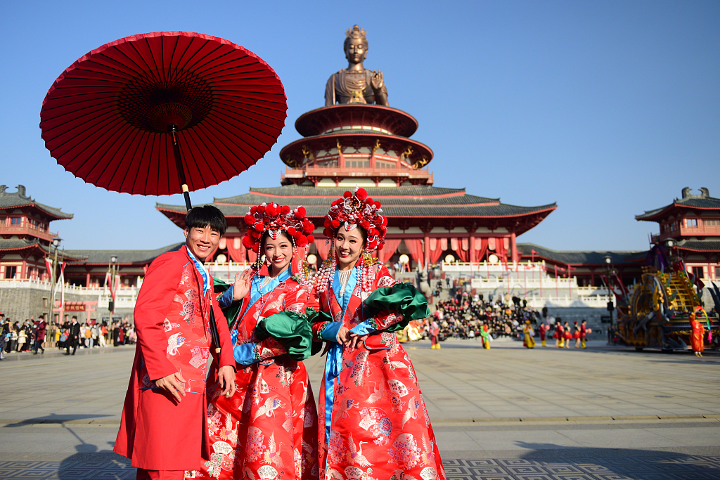 Young people in traditional Chinese costumes attend a parade in Suzhou, east China's Jiangsu Province, on February 17, 2021. /CFP