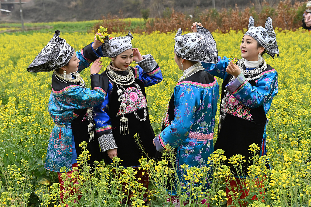 People dressed in traditional Chinese costumes attend a folk activity in Qiandongnan Miao and Dong Autonomous Prefecture, southwest China's Guizhou Province, on February 21, 2023. /CFP