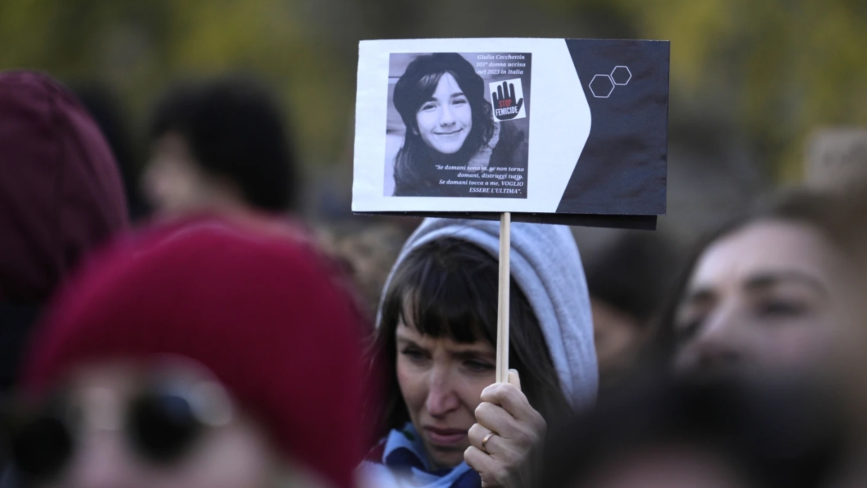 A woman shows a photo of Giulia Cecchettin, allegedly killed by an ex-boyfriend, on the occasion of International Day for the Elimination of Violence against Women, in Milan, Italy, November 25, 2023. /AP