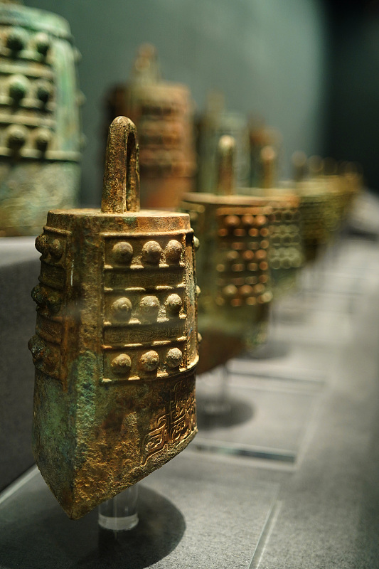 The photo, taken on November 24, 2023, shows a series of chime bells exhibited at the Chinese Archaeological Museum in Beijing. /CFP