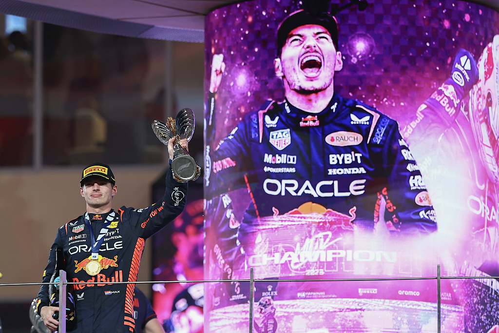 Max Verstappen of Red Bull Racing celebrates his win on the podium during the F1 Abu Dhabi Grand Prix at Yas Marina Circuit in Abu Dhabi, United Arab Emirates, November 26, 2023. /CFP