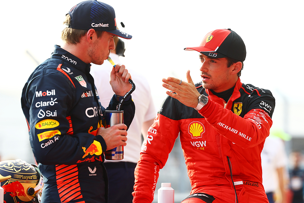 Max Verstappen (L) and Charles Leclerc of Ferrari talk in parc ferme ahead of the F1 Grand Prix of the United States at Circuit of the Americas in Austin, Texas, October 21, 2023. /CFP