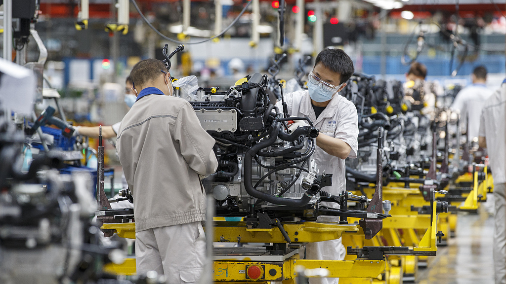 Employees work at the automobile production line of FAW-Volkswagen Chengdu Branch, Chengdu City, southwest China's Sichuang Province, May 16, 2022. /CFP