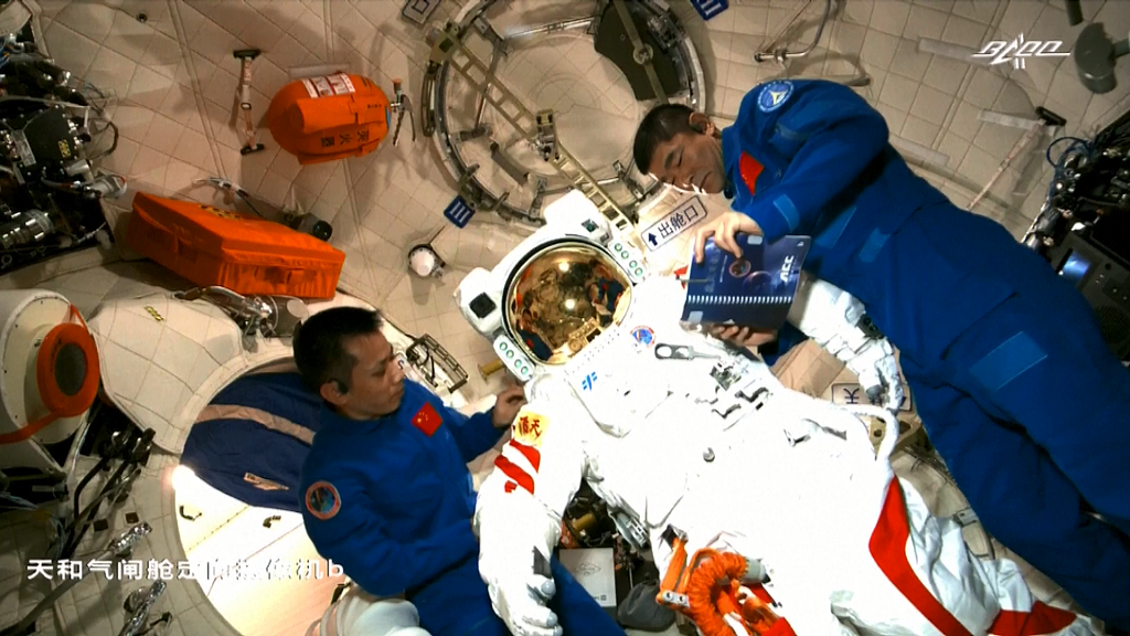 File photo: Shenzhou-12 astronauts Tang Hongbo (L) and Liu Boming (R) at the China Space Station. /CMSA