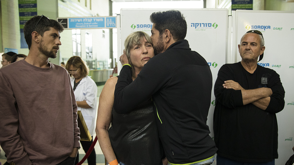 Uri Ravitz hugs his sister Tali Amano during a press conference regarding their mother's condition, after she was released from the Gaza Strip at Soroka hospital on November 27, 2023 in Beersheba, Israel. /CFP