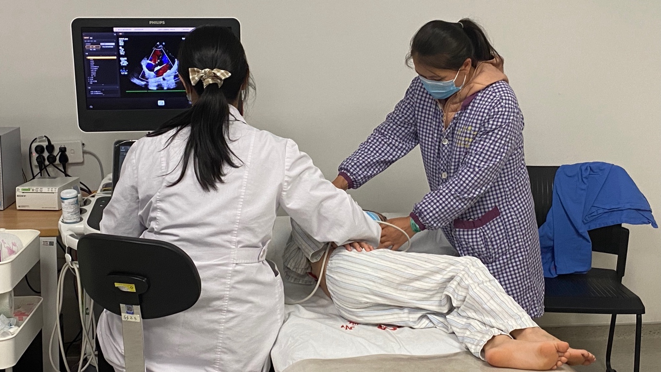 A heart disease patient from Laos receives color Doppler ultrasound check at Yunnan Fuwai Cardiovascular Hospital. Yang Jinghao/CGTN