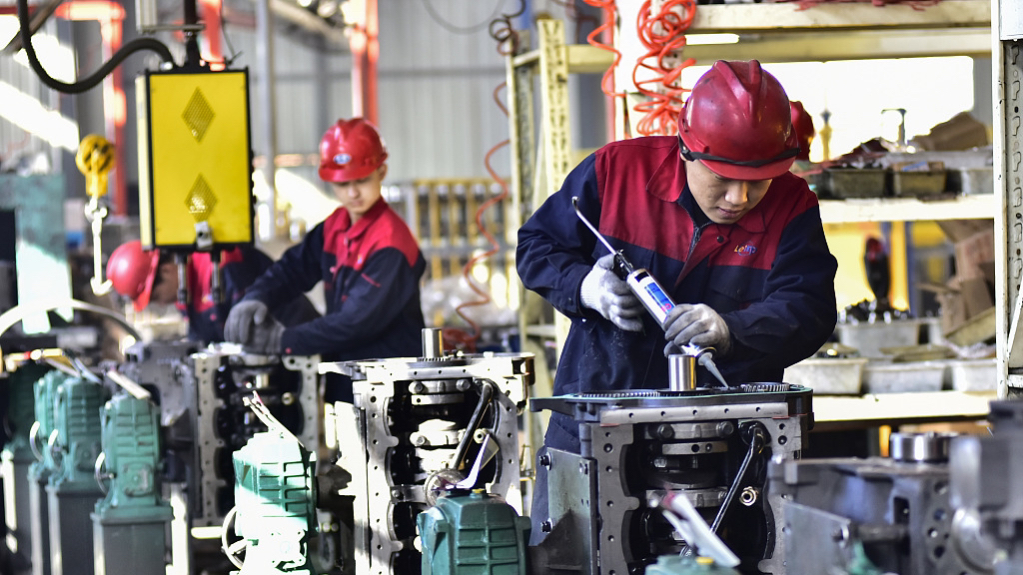 Workers assembling engines in an equipment manufacturing company in Qingzhou City, Shandong Province, China, November 30, 2023. /CFP