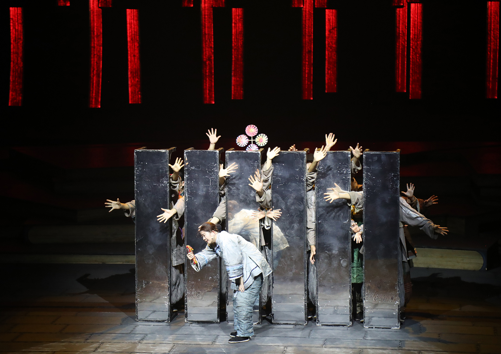 A scene from a play inspired by Lu Xun's novels featuring the struggles of Xianglin's wife in 