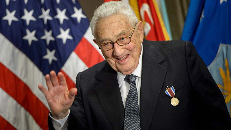 FILE: Former U.S. Secretary of State Henry Kissinger waves after receiving an award during a ceremony at the Pentagon honoring his diplomatic career in Washington, D.C, the U.S., May 9, 2016. /CFP