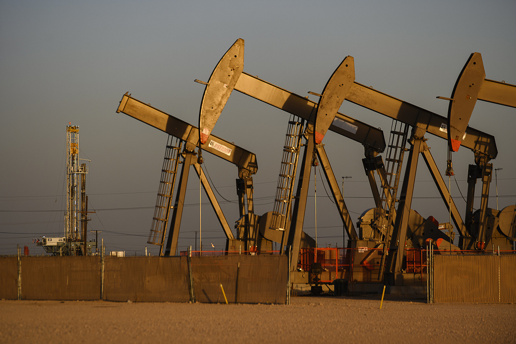 An array of pumpjacks operate near the site of a new oil and gas well in Midland, Texas, U.S., April 8, 2022. /CFP 