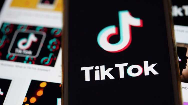 The logo of TikTok is seen on the screen of a smartphone in Arlington, Virginia, the United States. /Xinhua