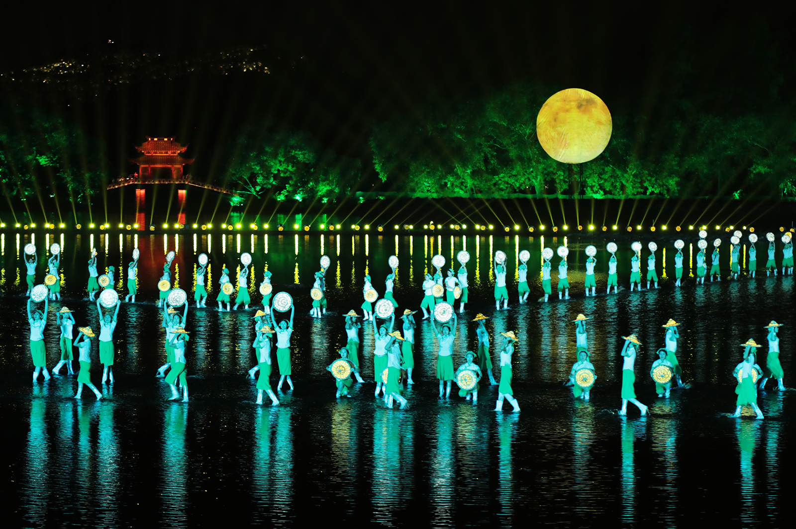 A dance depicting tea-picking is staged on the West Lake in Hangzhou, Zhejiang Province during the 