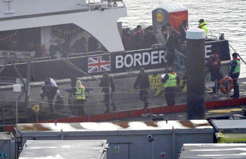 A group of people thought to be migrants are brought in to Dover, Kent, under freezing conditions from a Border Force vessel following a small boat incident in the Channel, December 2, 2023. /CFP