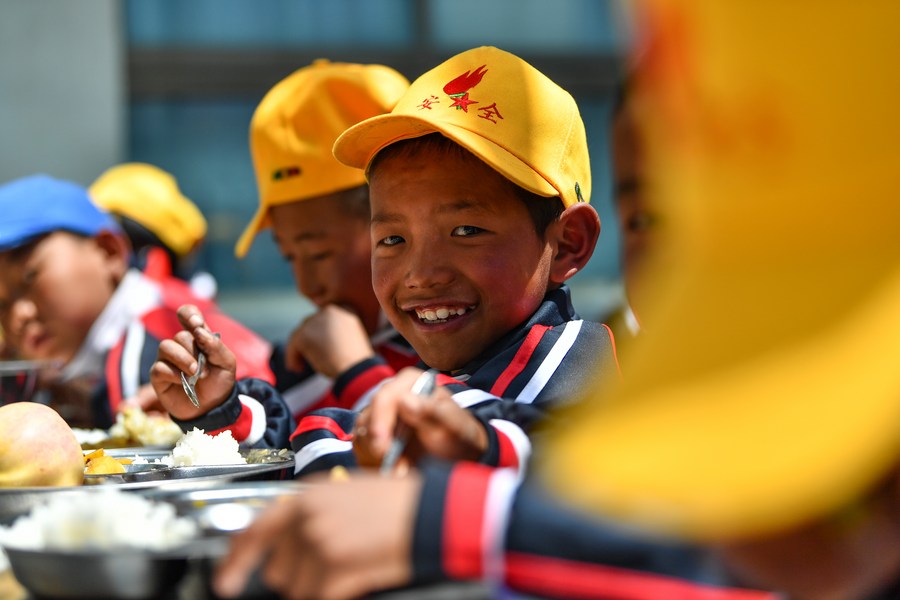 Pupils have lunch at the canteen of a primary school in the Zhaxizom Township in Tingri County, Xigaze City, southwest China's Xizang Autonomous Region, June 5, 2023. /Xinhua