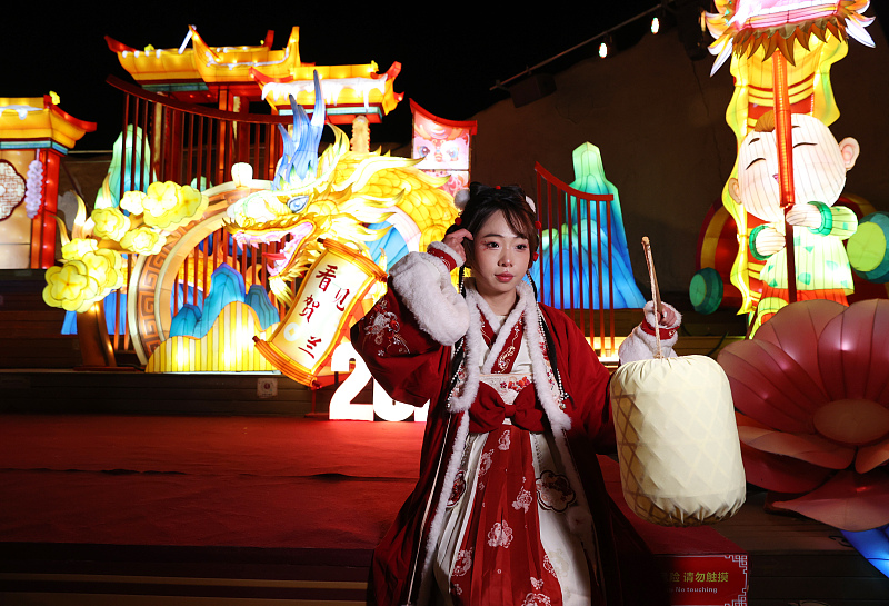 A series of colorful lanterns and light installations are on display at a popular tourist spot in Yinchuan City, Ningxia Hui Autonomous Region, attracting visitors to take photos, December 5, 2023. /CFP