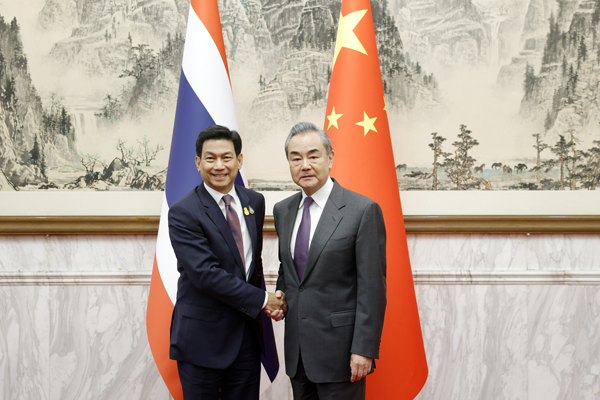 Chinese Foreign Minister Wang Yi (R), also a member of the Political Bureau of the CPC Central Committee, meets with Parnpree Bahiddha-Nukara, deputy prime minister and minister of foreign affairs of Thailand, in Beijing, China, December 6, 2023. /Chinese Foreign Ministry