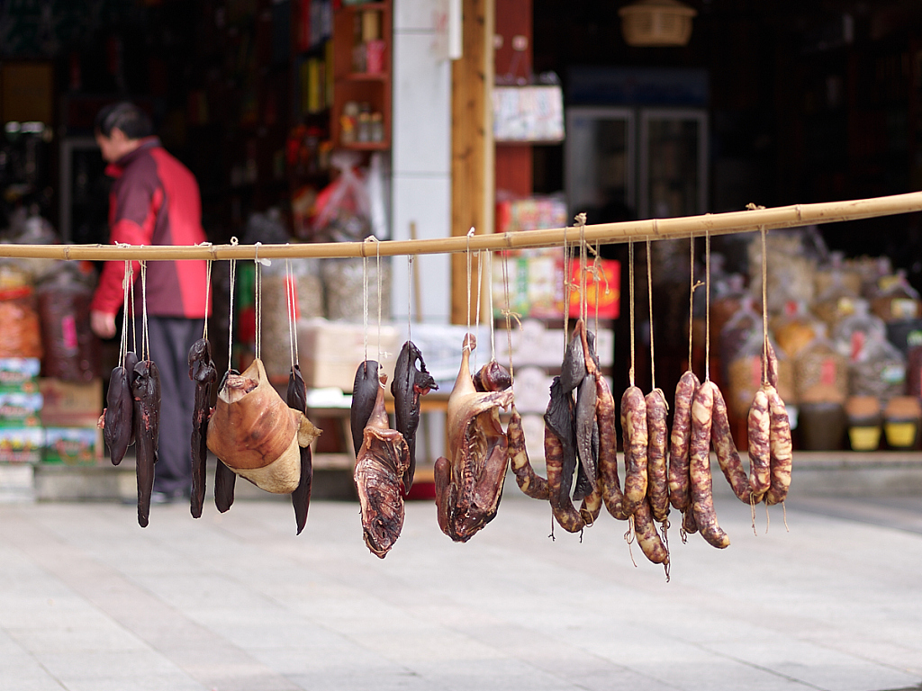 A file photo shows strands of salted meat hanging from a bamboo pole in Jinggangshan, Jiangxi Province. /CFP